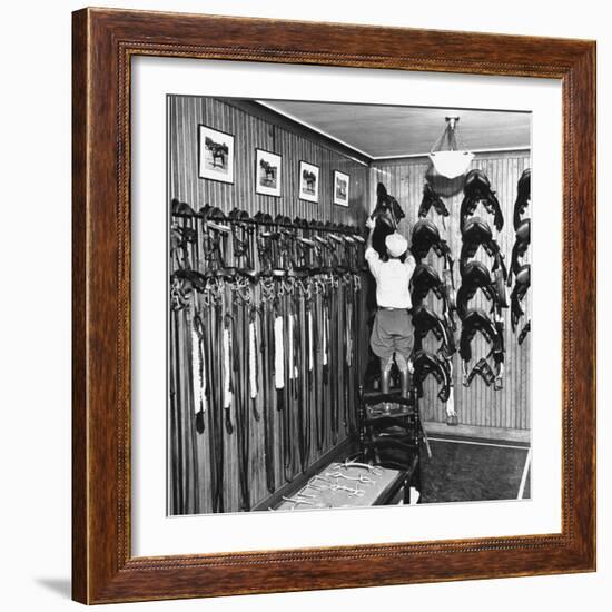 Man Checking Equipment Inside a Stable's Tack Room-Alfred Eisenstaedt-Framed Photographic Print