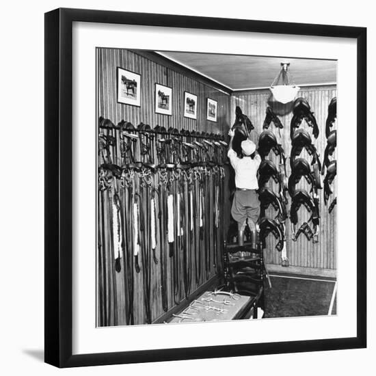 Man Checking Equipment Inside a Stable's Tack Room-Alfred Eisenstaedt-Framed Photographic Print