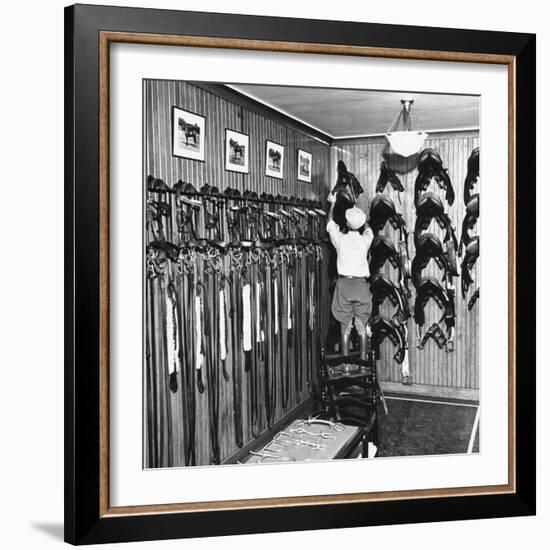 Man Checking Equipment Inside a Stable's Tack Room-Alfred Eisenstaedt-Framed Photographic Print