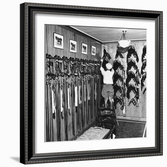 Man Checking Equipment Inside a Stable's Tack Room-Alfred Eisenstaedt-Framed Photographic Print