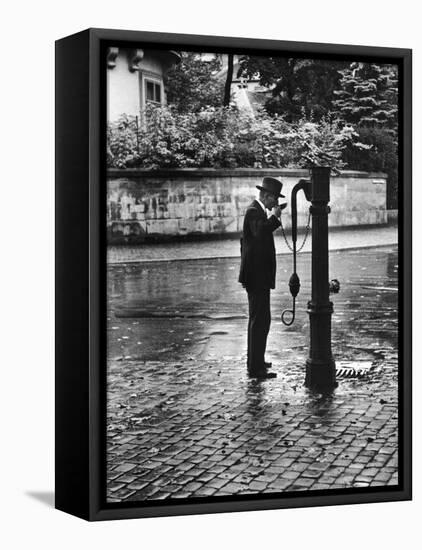 Man Drinking from Public Water Pump Fountain on Street, Frankfort-On-The-Main, Germany-Alfred Eisenstaedt-Framed Premier Image Canvas