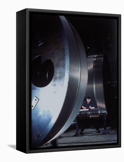 Man Dwarfed by Gigantic Gears He is Working on for the Navy, at General Electric Plant in US-Dmitri Kessel-Framed Premier Image Canvas