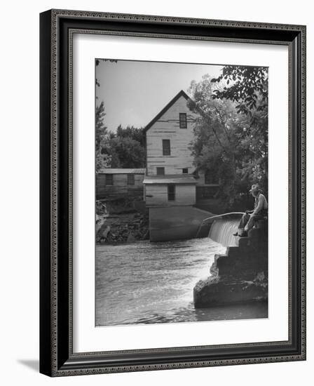 Man Fishing Beside a Waterfall and a 100 Year Old Mill-Bob Landry-Framed Photographic Print