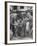 Man Fixing Basket on Bicycle as Children Watch Attentively-Nina Leen-Framed Photographic Print