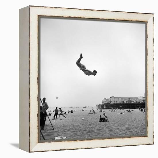 Man Flying Off a Trampoline at Santa Monica Beach-Loomis Dean-Framed Premier Image Canvas