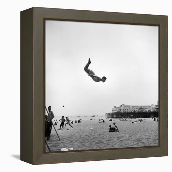 Man Flying Off a Trampoline at Santa Monica Beach-Loomis Dean-Framed Premier Image Canvas