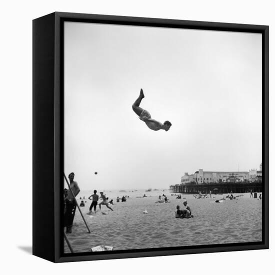 Man Flying Off a Trampoline at Santa Monica Beach-Loomis Dean-Framed Premier Image Canvas