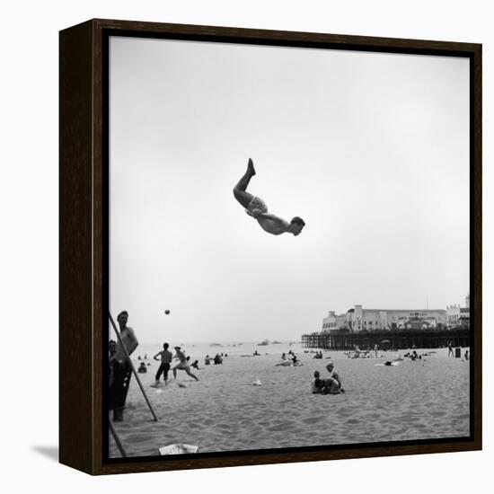 Man Flying Off a Trampoline at Santa Monica Beach-Loomis Dean-Framed Premier Image Canvas