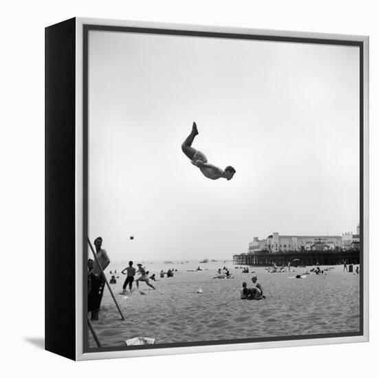 Man Flying Off a Trampoline at Santa Monica Beach-Loomis Dean-Framed Premier Image Canvas