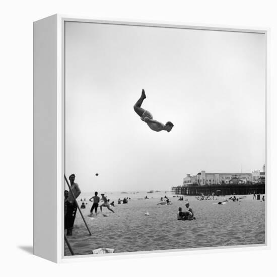 Man Flying Off a Trampoline at Santa Monica Beach-Loomis Dean-Framed Premier Image Canvas