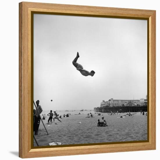 Man Flying Off a Trampoline at Santa Monica Beach-Loomis Dean-Framed Premier Image Canvas