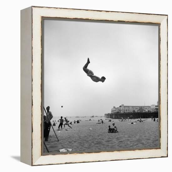 Man Flying Off a Trampoline at Santa Monica Beach-Loomis Dean-Framed Premier Image Canvas