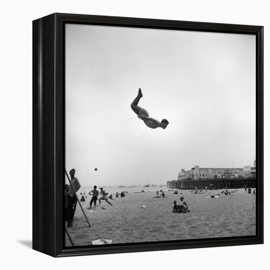 Man Flying Off a Trampoline at Santa Monica Beach-Loomis Dean-Framed Premier Image Canvas