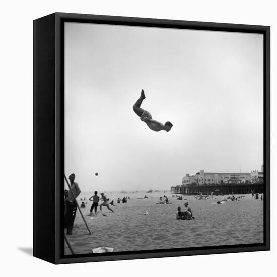 Man Flying Off a Trampoline at Santa Monica Beach-Loomis Dean-Framed Premier Image Canvas