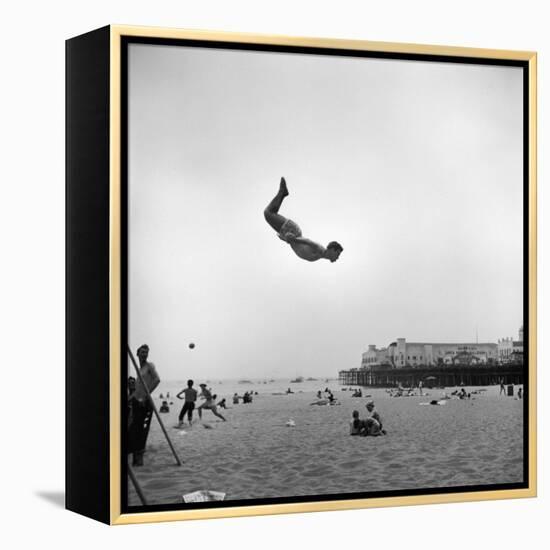 Man Flying Off a Trampoline at Santa Monica Beach-Loomis Dean-Framed Premier Image Canvas