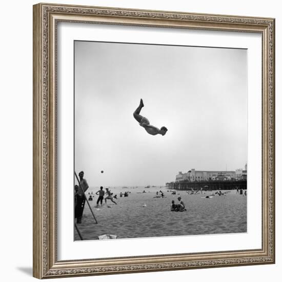 Man Flying Off a Trampoline at Santa Monica Beach-Loomis Dean-Framed Photographic Print