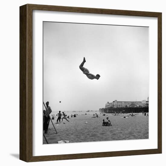 Man Flying Off a Trampoline at Santa Monica Beach-Loomis Dean-Framed Photographic Print