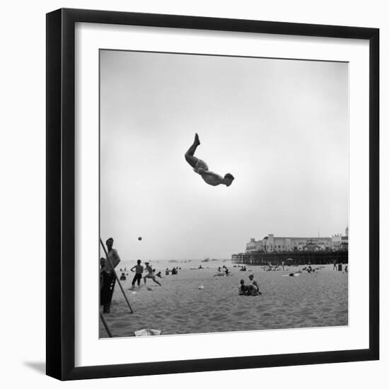 Man Flying Off a Trampoline at Santa Monica Beach-Loomis Dean-Framed Photographic Print