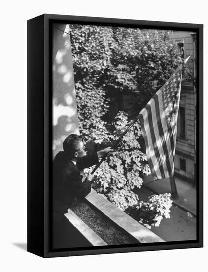 Man Hanging the American Flag Out of the Osteopath's Office Window During WWII-George Strock-Framed Premier Image Canvas