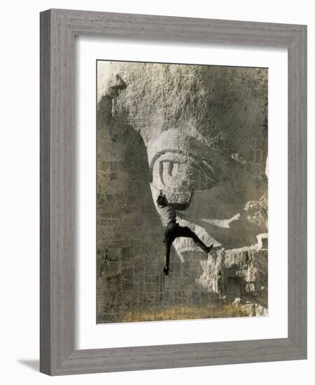 Man Hangs Onto Eye at Mount Rushmore-null-Framed Photographic Print