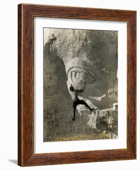 Man Hangs Onto Eye at Mount Rushmore-null-Framed Photographic Print