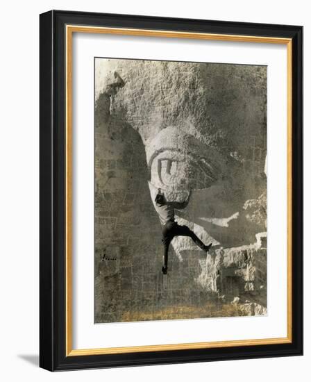 Man Hangs Onto Eye at Mount Rushmore-null-Framed Photographic Print