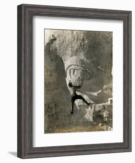 Man Hangs Onto Eye at Mount Rushmore-null-Framed Photographic Print