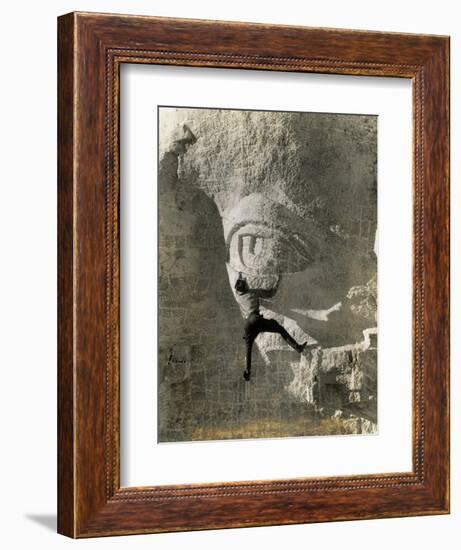 Man Hangs Onto Eye at Mount Rushmore-null-Framed Photographic Print