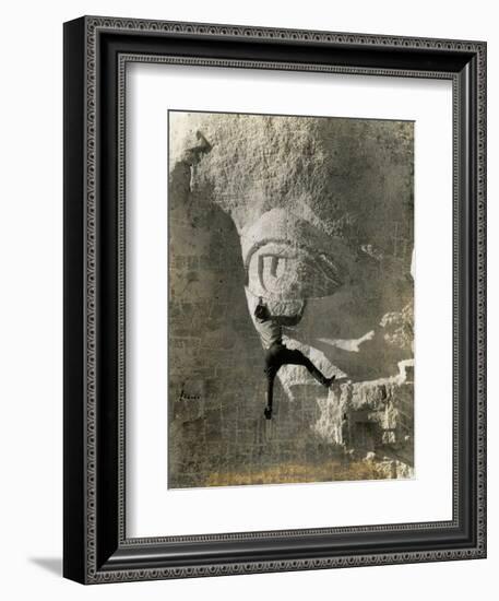 Man Hangs Onto Eye at Mount Rushmore-null-Framed Photographic Print