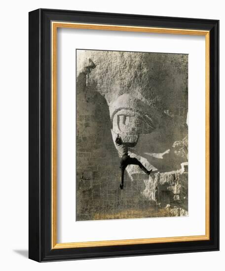 Man Hangs Onto Eye at Mount Rushmore-null-Framed Photographic Print