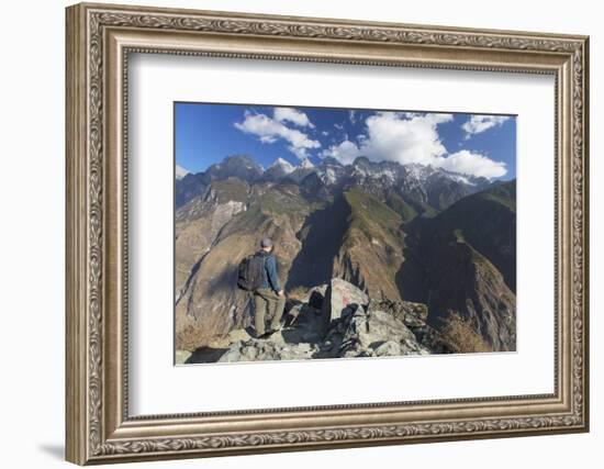 Man hiking in Tiger Leaping Gorge, UNESCO World Heritage Site, with Jade Dragon Snow Mountain (Yulo-Ian Trower-Framed Photographic Print