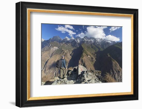 Man hiking in Tiger Leaping Gorge, UNESCO World Heritage Site, with Jade Dragon Snow Mountain (Yulo-Ian Trower-Framed Photographic Print