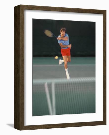 Man Hitting Tennis Ball-Bill Bachmann-Framed Photographic Print