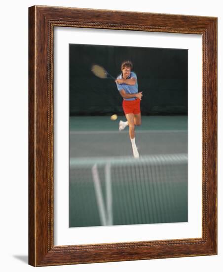 Man Hitting Tennis Ball-Bill Bachmann-Framed Photographic Print