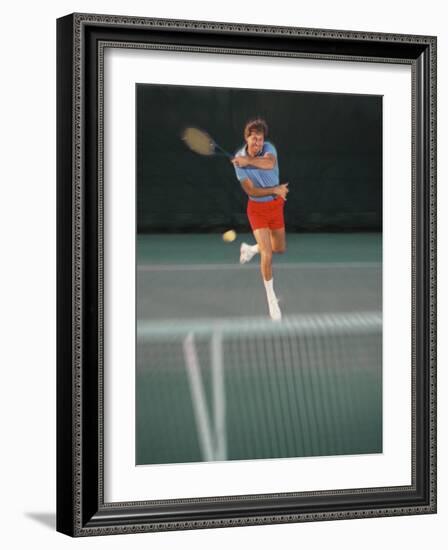 Man Hitting Tennis Ball-Bill Bachmann-Framed Photographic Print