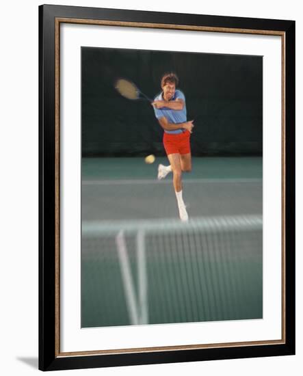 Man Hitting Tennis Ball-Bill Bachmann-Framed Photographic Print