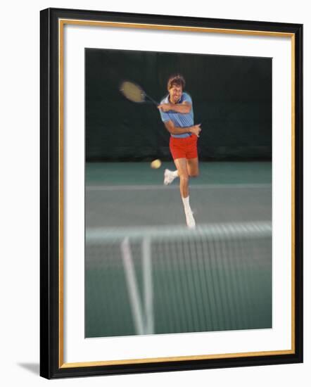 Man Hitting Tennis Ball-Bill Bachmann-Framed Photographic Print