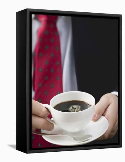 Man Holding Cup of Coffee-null-Framed Premier Image Canvas