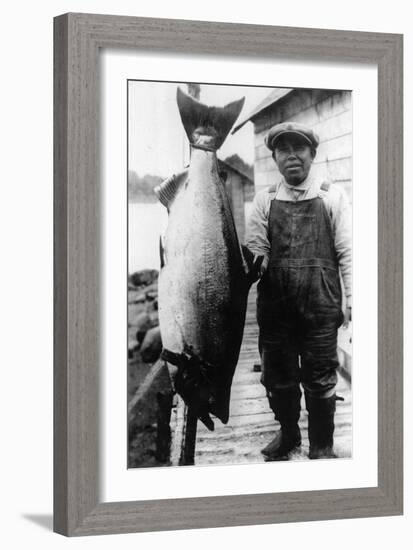 Man Holding Life Size King Salmon - Alaska-Lantern Press-Framed Art Print