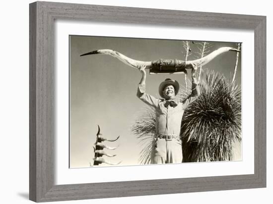 Man Holding Longhorns-null-Framed Art Print