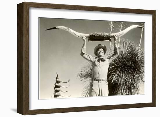 Man Holding Longhorns-null-Framed Art Print