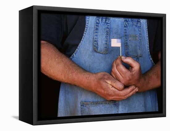 Man Holding Small American Flag-Bob Rowan-Framed Premier Image Canvas