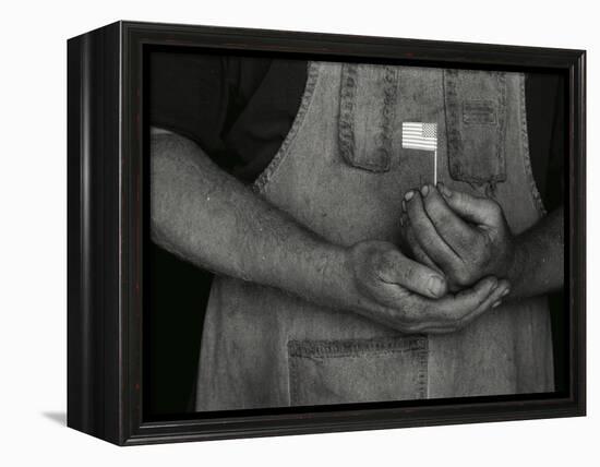 Man Holding Small American Flag-Bob Rowan-Framed Premier Image Canvas