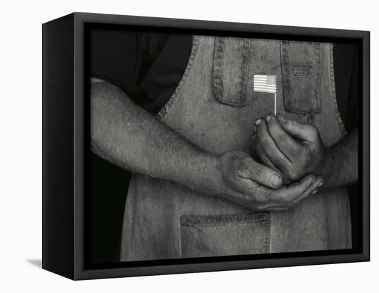 Man Holding Small American Flag-Bob Rowan-Framed Premier Image Canvas