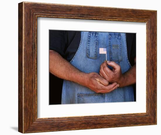 Man Holding Small American Flag-Bob Rowan-Framed Photographic Print