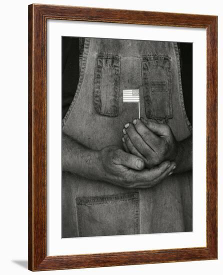 Man Holding Small American Flag-Bob Rowan-Framed Photographic Print