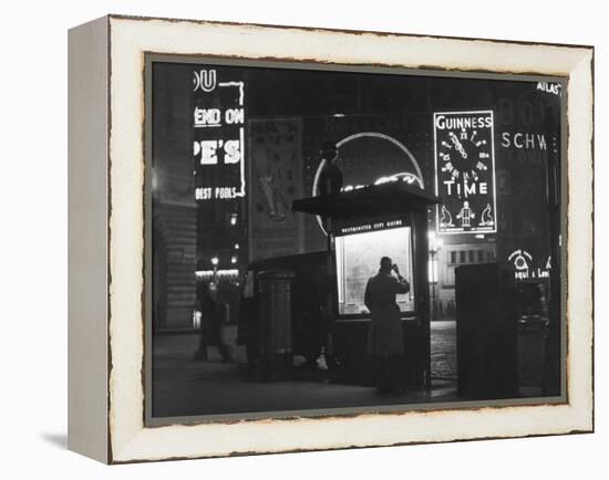 Man in a Raincoat Studies the Westminster City Guide Map at Night in Piccadilly Circus-null-Framed Premier Image Canvas