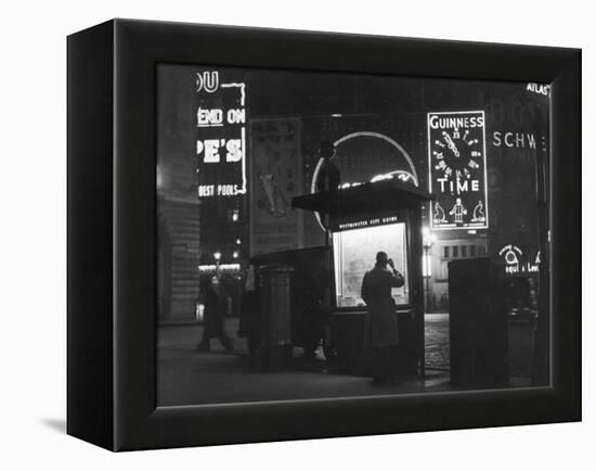 Man in a Raincoat Studies the Westminster City Guide Map at Night in Piccadilly Circus-null-Framed Premier Image Canvas