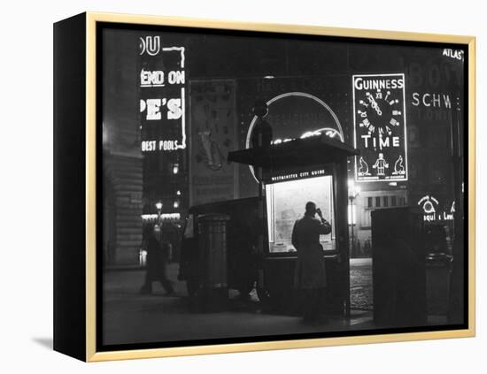 Man in a Raincoat Studies the Westminster City Guide Map at Night in Piccadilly Circus-null-Framed Premier Image Canvas