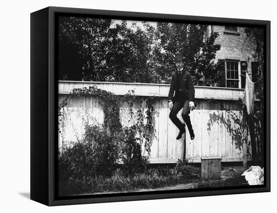 Man in a Suit and Bowler Hat Jumping in the Air in a Backyard in Brooklyn, Ny-Wallace G^ Levison-Framed Premier Image Canvas